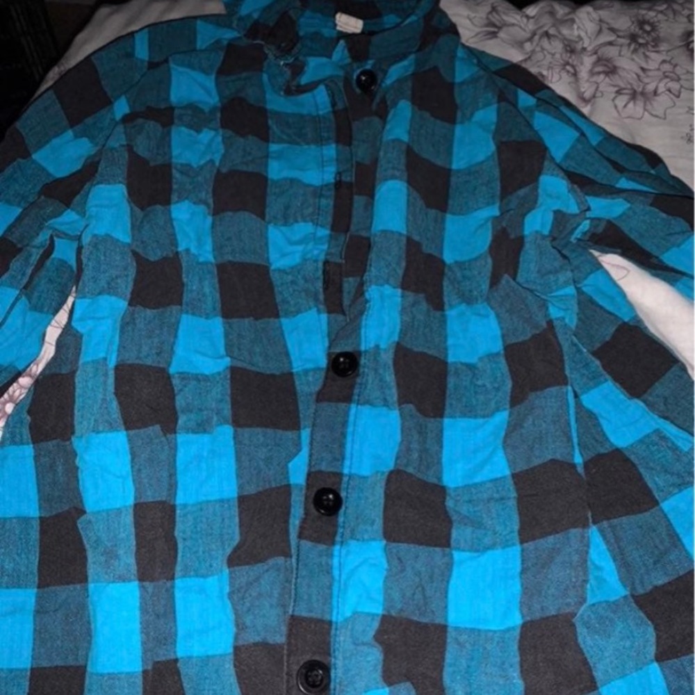 Blue and black flannel 
SOS brand size is large, but it fits like a medium.